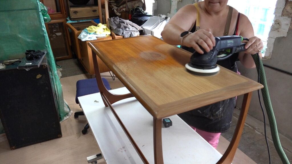 G-Plan Astro Long John coffee table with water damaged veneer, being sanded with Festool RO150 sander