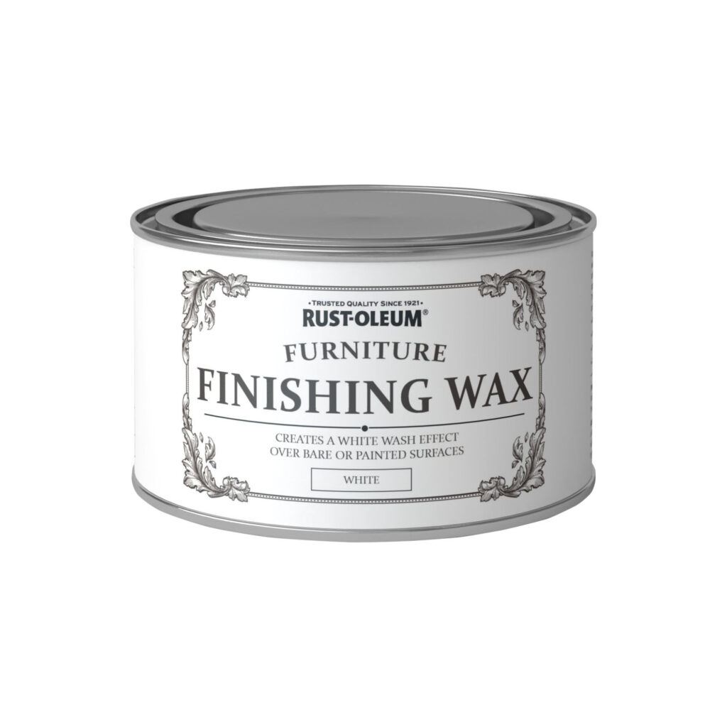 A can of Rust-Oleum Furniture Finishing Wax with a white label featuring decorative borders. The text reads: "Trusted Quality Since 1921, Rust-Oleum, Furniture Finishing Wax, Creates a White Wash Effect Over Bare or Painted Surfaces, Ideal for Painting Furniture, White.