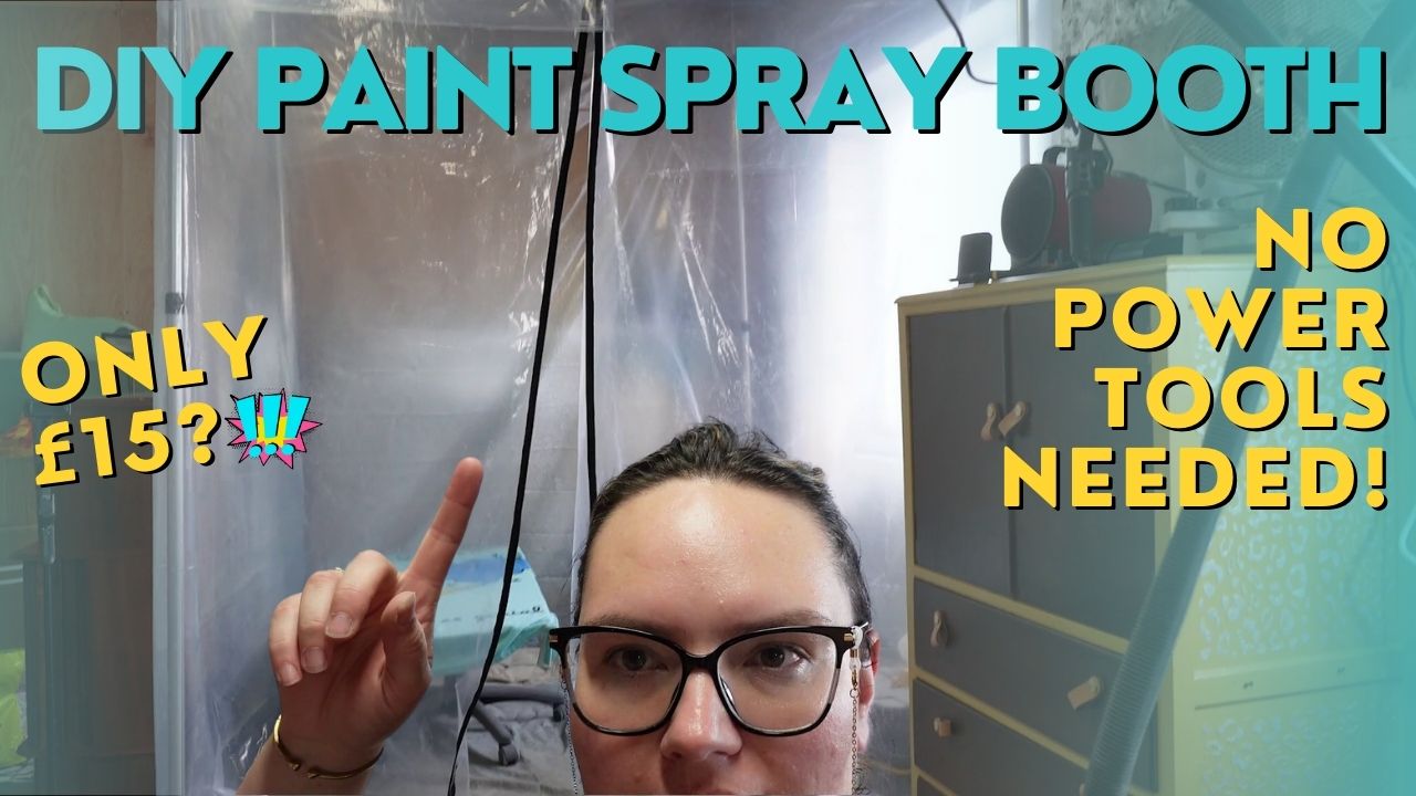 A person is pointing upwards while standing in front of a DIY paint spray booth made of clear plastic sheets. Text on the image reads "DIY PAINT SPRAY BOOTH," "ONLY £15?!" and "NO POWER TOOLS NEEDED!" A ladder and furniture are visible in the background.