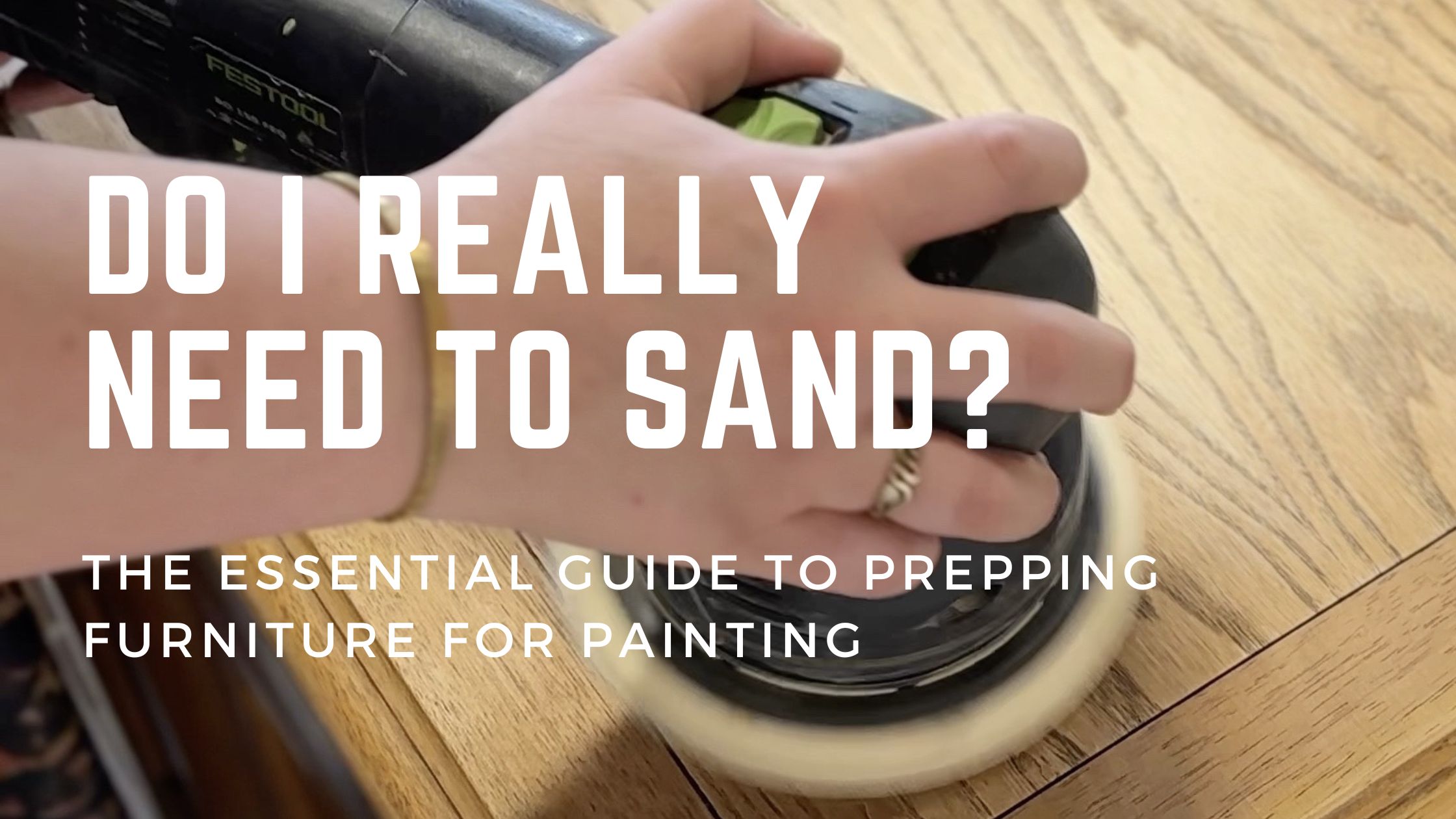 A person is using an electric sander on a wooden surface. The text on the image reads, "Do I really need to sand? The essential guide to prepping furniture for painting." The person has a ring on their finger and a light-colored bracelet on their wrist.