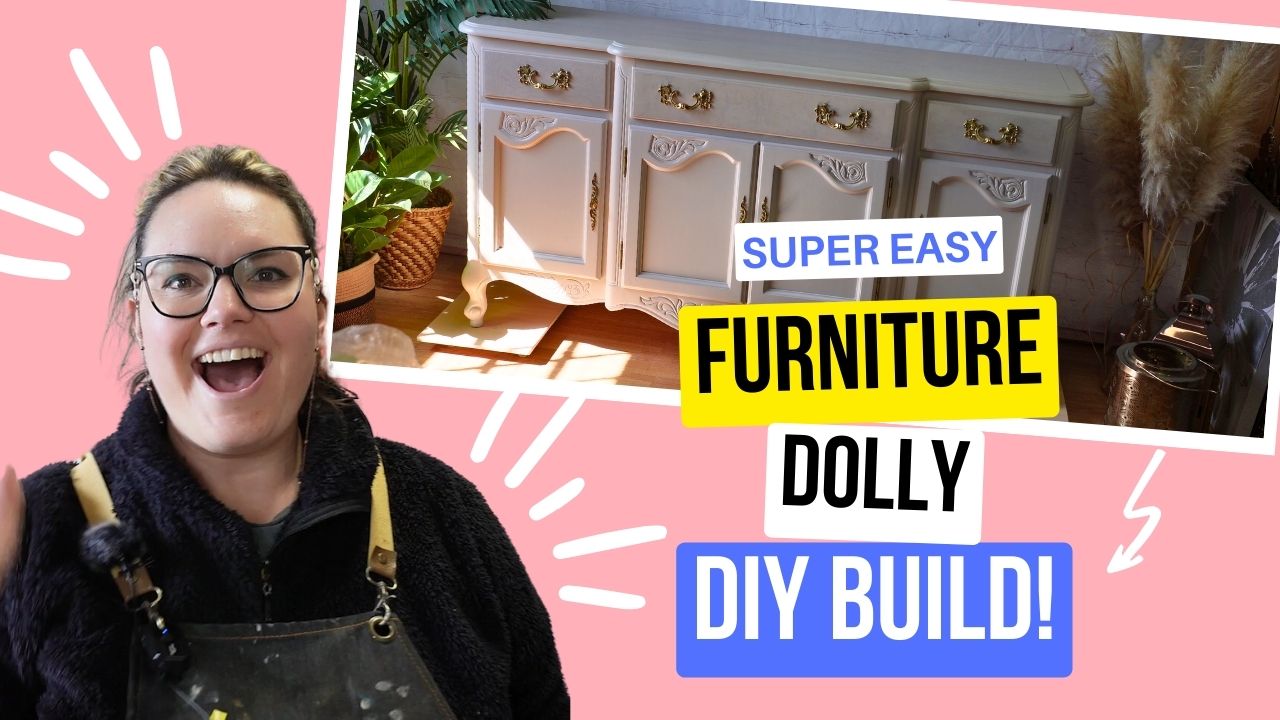 A cheerful person wearing glasses and an apron smiles at the camera. A text overlay reads "Super Easy Furniture Dolly DIY Build!" Beside them is an image of a white, vintage-style cabinet with gold handles and decorative carvings. The background is pink with white accents.