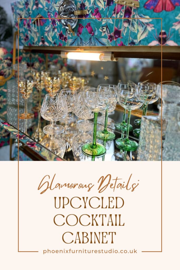 A glamorous upcycled cocktail cabinet filled with an array of vintage glassware, including gold-rimmed and green-stemmed glasses. The cabinet has a mirrored back and a stylish retro design. Text overlays say "Glamorous Details: Upcycled Cocktail Cabinet, phoenixfurniturestudio.co.uk.