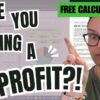 A person wearing glasses and pointing to the right stands beside a digital screen displaying a profit margin calculator. The text reads: "ARE YOU MAKING A PROFIT?!" with a green arrow and dollar symbol graphic. A green label says "FREE CALCULATOR.