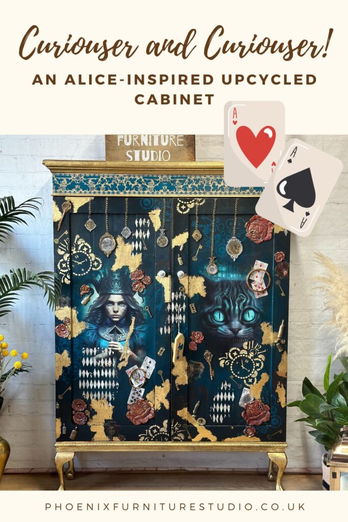 An upcycled cabinet inspired by "Alice in Wonderland" with a design featuring Alice and the Cheshire Cat among playing cards, keys, and roses. The top sign reads "Furniture Studio." There are some plants on either side of the cabinet and cards floating.