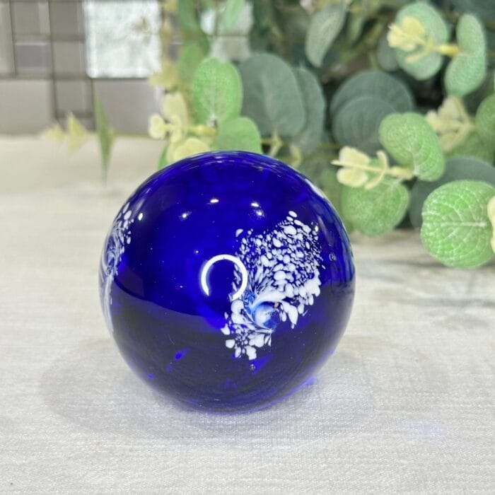 Cobalt Blue Glass Paperweight with White Feather Design - Image 1